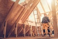 Professional Construction Worker Inside Newly Built Wooden Frame House