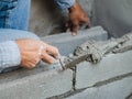 Professional construction worker laying bricks with cement Royalty Free Stock Photo