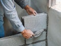 Professional construction worker laying bricks with cement Royalty Free Stock Photo