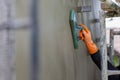 Professional contractor plastering wall with sponge float to make a smooth rendering Royalty Free Stock Photo