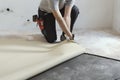 Contractor removing an old linoleum flooring