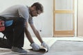 Contractor removing an old linoleum flooring