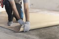 Contractor removing an old linoleum flooring