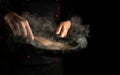 Professional cook frying burger cutlets in a frying pan. Close-up of a chef hands with a hot pan in the kitchen. Free space for Royalty Free Stock Photo