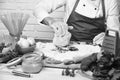 Professional cookery concept. Male hands work with kneaded dough on white brick background