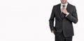 Professional corporate business professional businessman man crop view fixing necktie in suit