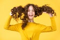 Professional cosmetics. Freedom self expression. Girl hairdresser salon. Brushing long hair. Little child curly hair