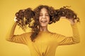 Professional cosmetics. Freedom self expression. Girl hairdresser salon. Brushing long hair. Little child curly hair