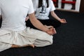 Professional couple young man and woman doing yoga in the fitness studio. Close-up Royalty Free Stock Photo