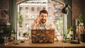 Professional Creative Man Sitting at a Desk at Home Office Studio, Working on Laptop Computer Royalty Free Stock Photo
