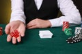Professional croupier with dice at gambling table, closeup Royalty Free Stock Photo