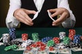 Professional croupier shuffling cards at gambling table, closeup Royalty Free Stock Photo