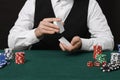 Professional croupier shuffling cards at gambling table, closeup Royalty Free Stock Photo