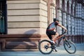 Cyclist riding along old city streets Royalty Free Stock Photo