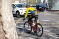 Professional cyclist in a helmet on the road in the city