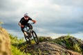 Professional Cyclist Riding the Bike on the Rocky Trail. Extreme Sport.