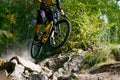 Professional Cyclist Riding the Mountain Bike on Autumn Forest Trail. Extreme Sport and Enduro Cycling Concept. Royalty Free Stock Photo