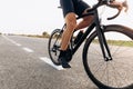 Professional cyclist riding bike on paved road Royalty Free Stock Photo