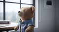 Business Teddy Bear Sitting at an Office Desk Looking Out the Window Royalty Free Stock Photo