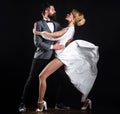 Professional dancers in ballroom. Sensual couple in love dancing tango with passion. Royalty Free Stock Photo
