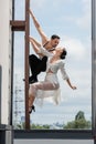 Professional dancers kissing while posing on