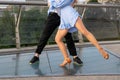 Professional dancers legs. Couple man and woman are dancing on the street Royalty Free Stock Photo