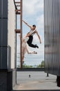 Professional dancers posing on ladder on