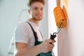 Professional decorator painting wall. Home repair service Royalty Free Stock Photo