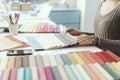 Professional decorator picking fabric swatches Royalty Free Stock Photo