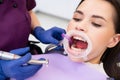 Professional dentist examines patients teeth in stomatology clinic Royalty Free Stock Photo