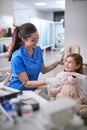 Professional dentist office.Little girl visiting dentist