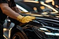 Professional Detailing a Luxury Car in a Workshop