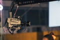 Professional digitak video camera on crane record live on event broadcasting at night concert outdoors Royalty Free Stock Photo