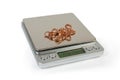 Professional digital table scales and gold jewelry on them closeup Royalty Free Stock Photo