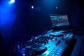 Professional DJ music controller in booth in night club
