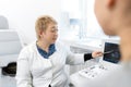 Professional doctor advises the patient young girl after ultrasound