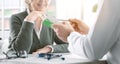 Professional doctor giving a prescription medicine to a senior patient Royalty Free Stock Photo