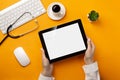 Professional doctor writing medical records in a digital tablet with stethoscope, keyboard, coffee cup and mouse Royalty Free Stock Photo