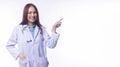 Professional doctor young woman wear white coat with stethoscope pointing her finger to something while looking at camera on Royalty Free Stock Photo