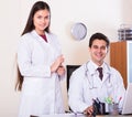 Professional doctors smiling in clinic