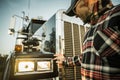 Professional Driver Checking On His Semi Truck Headlights Royalty Free Stock Photo