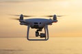 Professional drone quad copter with digital camera at sunset ready to fly for surveillance. close-up of Rotor UAV. four Royalty Free Stock Photo