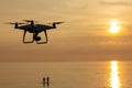 Professional drone quad copter with digital camera at sunset ready to fly for surveillance. close-up of Rotor UAV. four Royalty Free Stock Photo