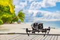 Drone hoovering above wooden deck on tropical island shore. Exotic nature landscape,