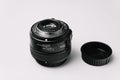 Professional DSLR Camera Lens and Cap on White Royalty Free Stock Photo