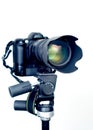 Professional DSLR camera with telephoto zoom lens on tripod Royalty Free Stock Photo