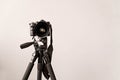 Professional DSLR camera on a tripod isolated on gray background with copy space Royalty Free Stock Photo