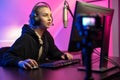 Professional e-sport gamer girl streaming and plays online video game on PC Royalty Free Stock Photo