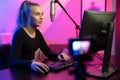 Professional e-sport gamer girl streaming and plays online video game on PC Royalty Free Stock Photo