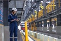 Professional electricity train rail engineer worker working train service inspector checking track rail system in train depot Royalty Free Stock Photo